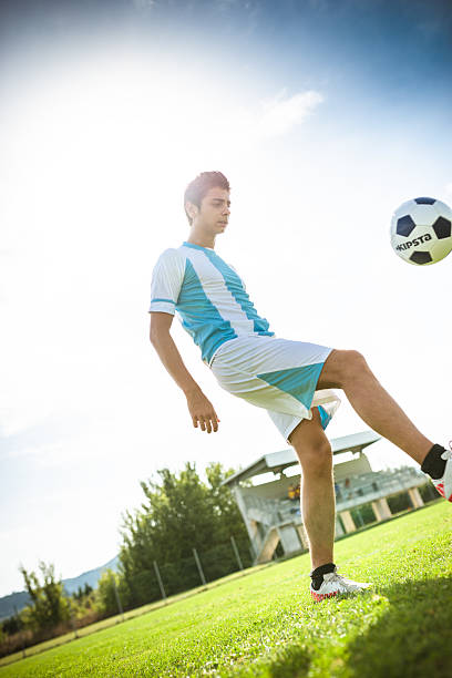 istock Soccer player playing with soccer ball 514913678