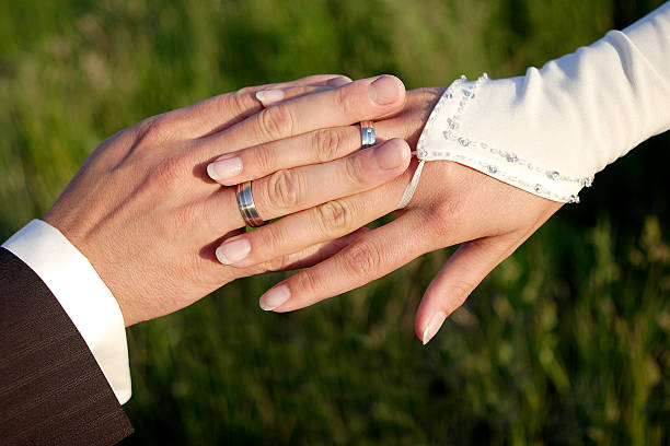 istock Hands of a bride and groom 514913767