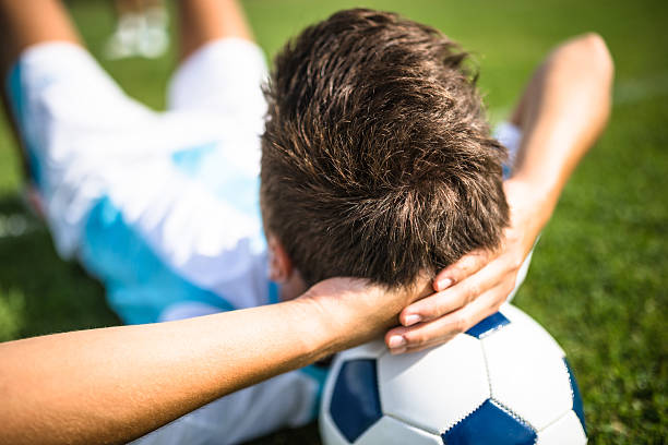 istock Soccer player relaxing on the pitch 514913842