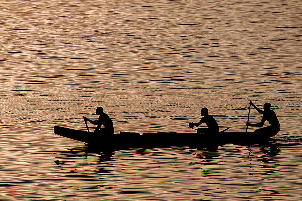 istock dark-skinned rowers in a boat rowing oars 514914600