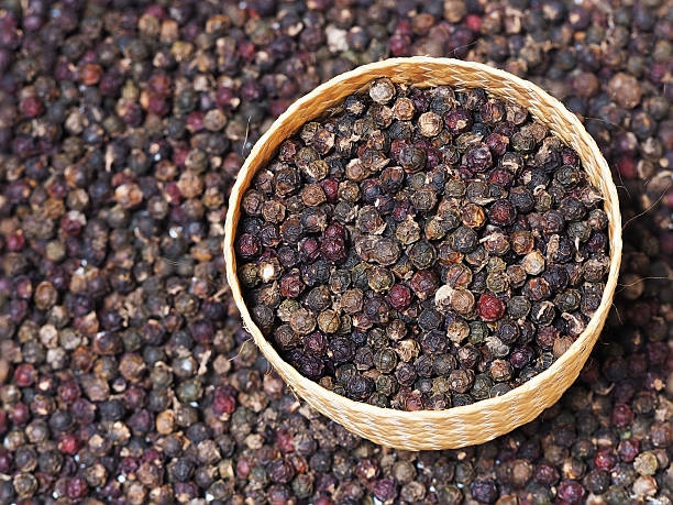 Black peppercorn background. Dried black pepper in weave bowl. Black peppercorn background. Dried black pepper in weave bowl. Pepper seed. acrid taste stock pictures, royalty-free photos & images