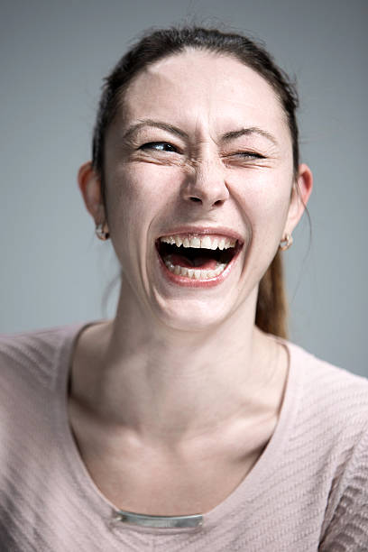 istock The happy woman on gray background 514916482