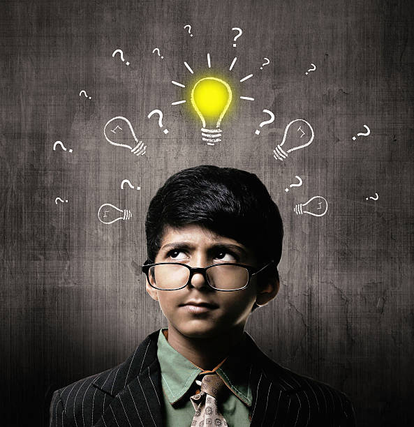 istock Genius Little Boy Wearing Glasses, Thinking Idea Near Chalkboard 514916578