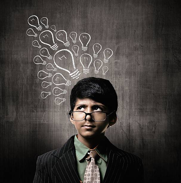 Genius Little Boy Wearing Glasses, Thinking Ideas Bulb stock photo
