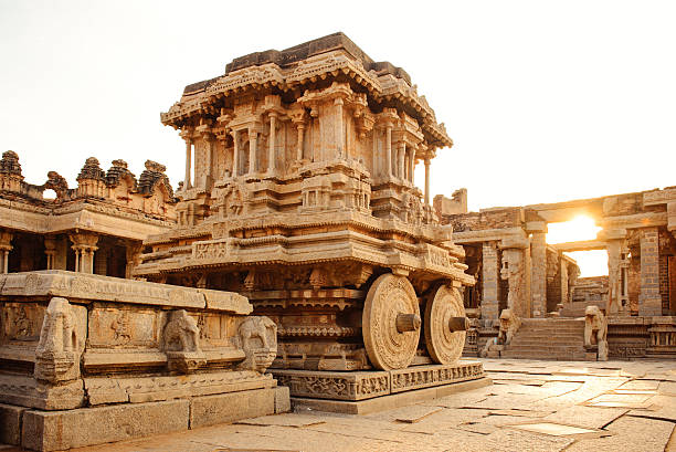 istock Stone chariot in Hampi Vittala Temple at sunset 514919718