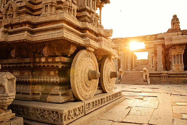 istock Stone chariot in Hampi Vittala Temple at sunset 514920158