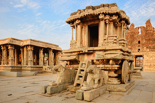 istock Stone chariot in Hampi Vittala Temple at sunset 514920554