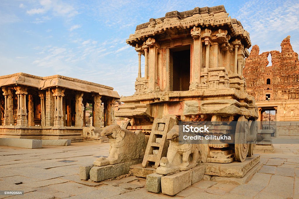 Stone chariot in Hampi Vittala Temple at sunset Stone chariot in courtyard of Vittala Temple at sunset in Hampi, Karnataka, India Ancient Stock Photo