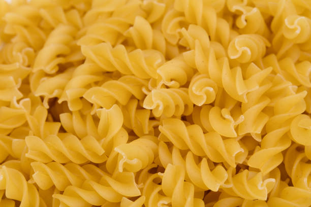 background of dry pasta (isolated on white)