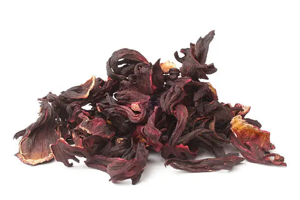 Dried hibiscus calyces on white background