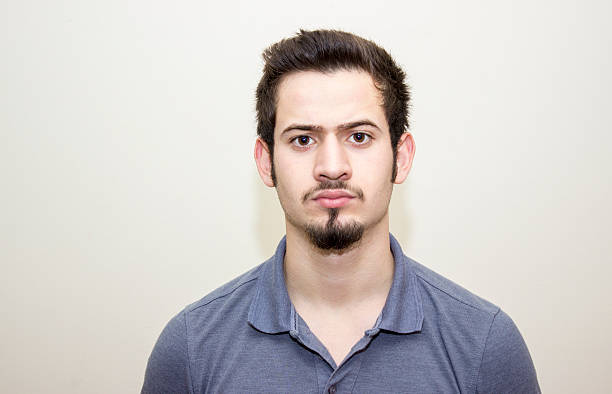 istock Portrait of furious young man over colored background 514923032
