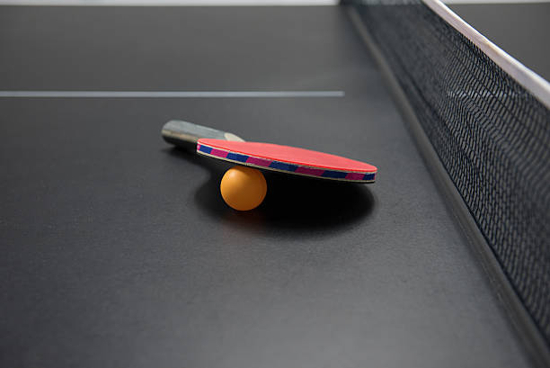 istock table tennis racket with orange ball 514924810