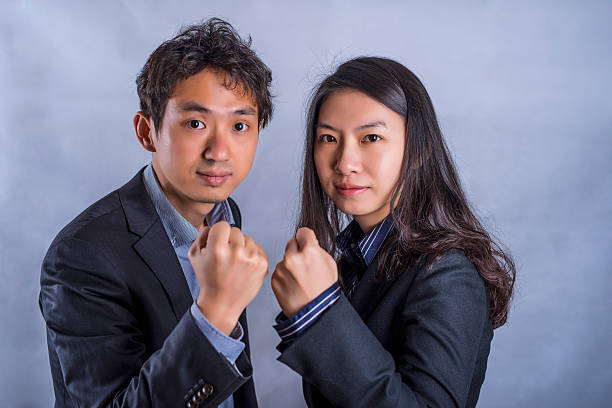 istock Confident Asian business couple standing next to each other 514925190