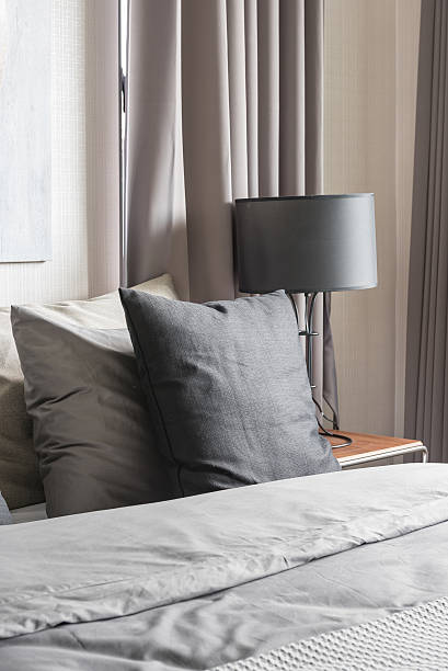 istock grey pillow on white bed in modern bedroom 514925492
