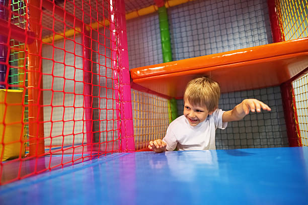 istock Little boy running in the indoors playground 514926046