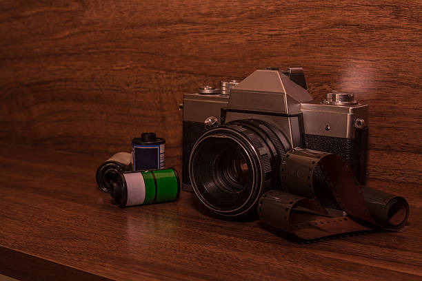 istock Old vintage camera on wood background 514927052