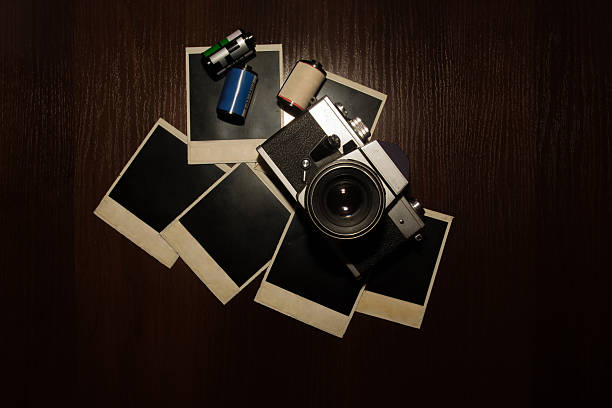 istock Old vintage camera with frame and photo film 514928490