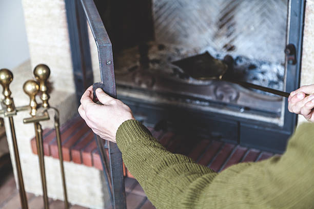 istock Man cleans brass fireplace shovel 514929852