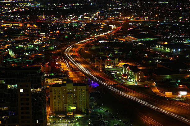 EL PASO, TEXAS MAN OVERLOOKING THE CITY AT NIGHT WIDE VIEW