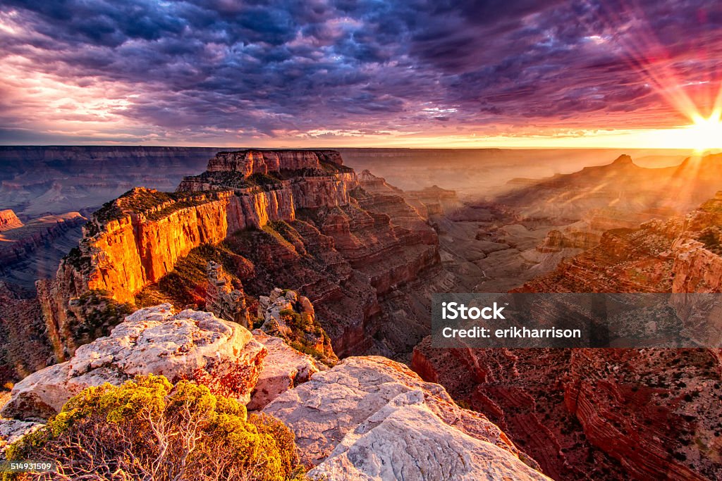 North Rim Grand Canyon Cape Royal Sunset from the over look on Cape Royal. Wild fires caused the spectacular colors in the sky and enhanced the orange glow on the sandstone walls. Grand Canyon National Park Stock Photo