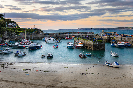 Newquay fishing harbour at sunset. Cornwall, England