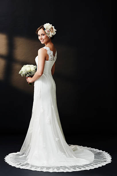 istock Glamorous young bride in wedding dress, smiling 514934389