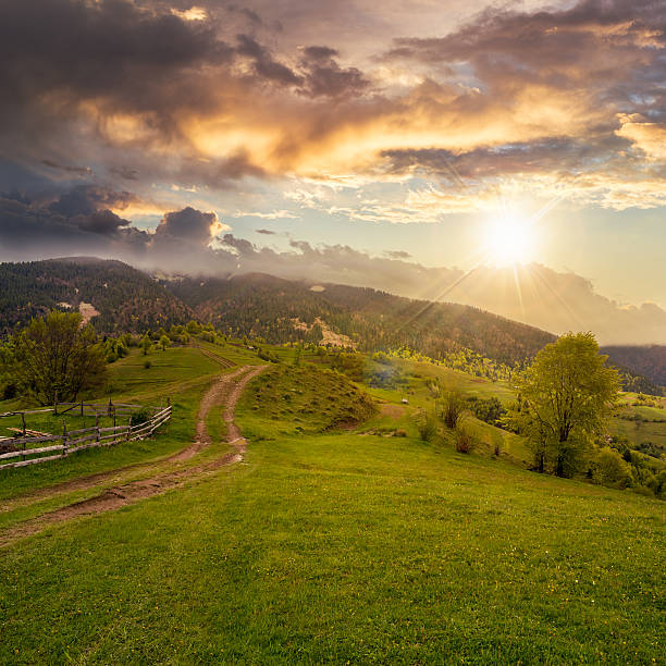 istock fence on hillside meadow in mountain at sunset 514934959