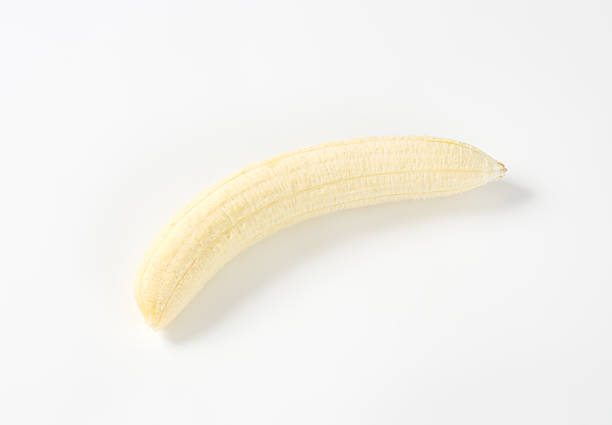 istock Peeled banana on white background 514934990
