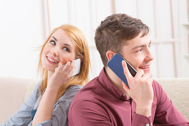 istock Couple talking on their smartphones 514935088