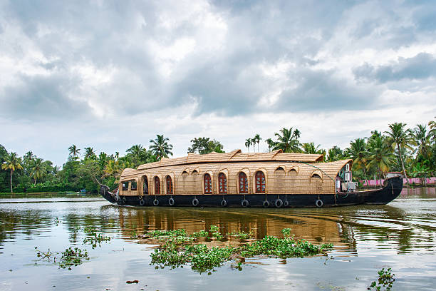Traditional Indian houseboat in Kerala, India Traditional Indian houseboat near Alleppey  on Kerala backwaters, India houseboat photos stock pictures, royalty-free photos & images