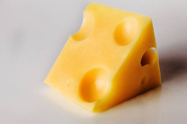 istock piece of cheese with holes 514935856