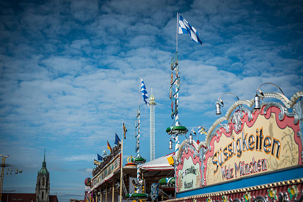 Oktoberfest Munich Munich, Germany - September 26, 2014: Oktoberfest Munich carousel, people are having fun in a carousel and rollercoaster large german beer steins stock pictures, royalty-free photos & images