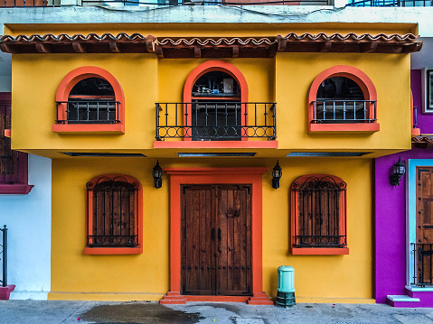 Puerto Vallarta, Mexico - January 3, 2015: Colorful buildings located along a tourist street in central old Puerto Vallarta. Photo taken during the day and contains no people.