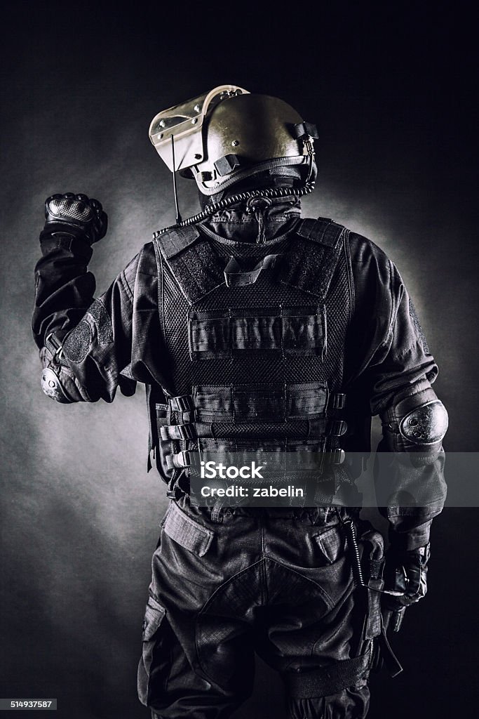 Spec ops Spec ops soldier on black background shot from behind Black Color Stock Photo