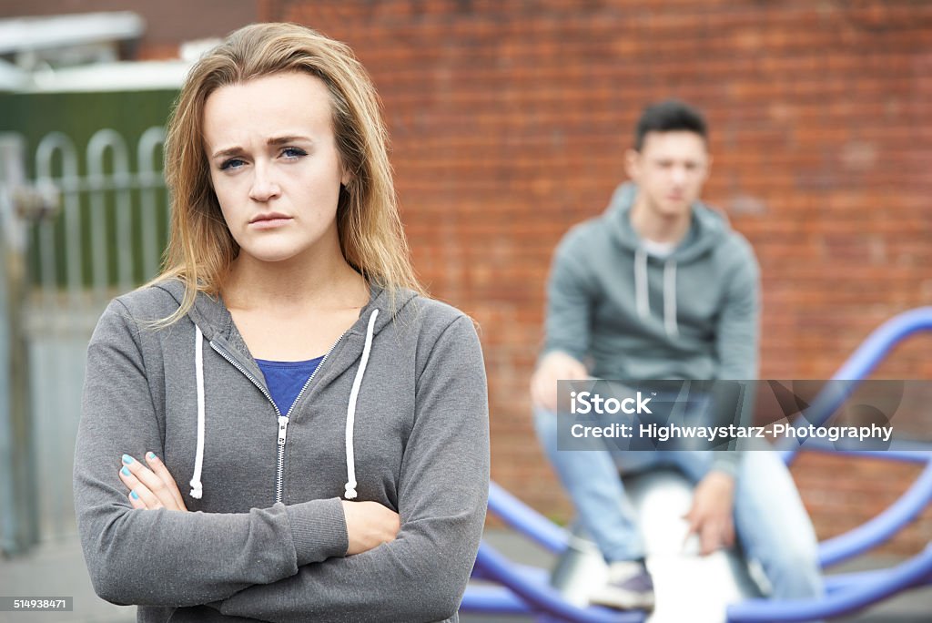 Portrait Of Unhappy Teenage Couple In Urban Setting Confusion Stock Photo