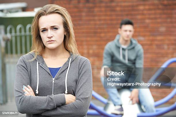 Portrait Of Unhappy Teenage Couple In Urban Setting Stock Photo - Download Image Now