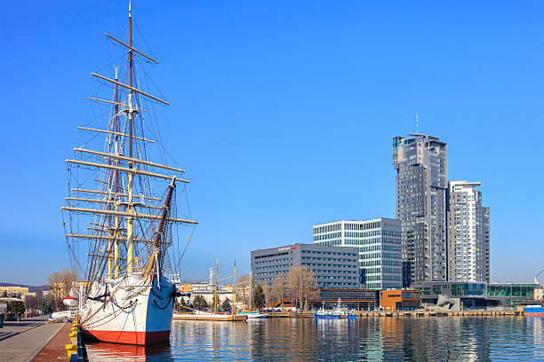 Gdynia, Poland - March 18, 2015: Polish training tall ship Dar Pomorza on the background of the city of Gdynia, Poland.