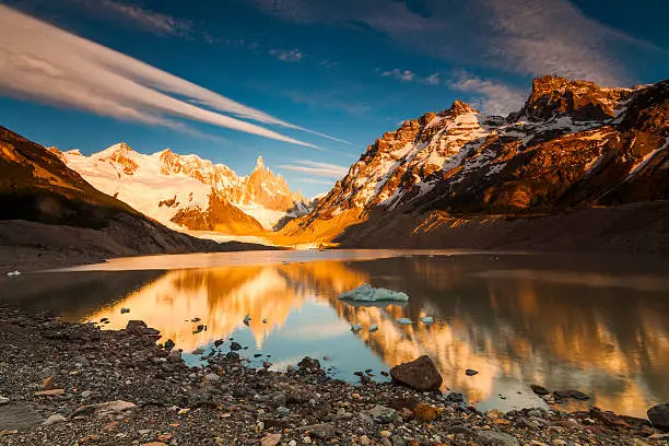 Cerro Torre, Los Glaciares National Park. Reflection of mountains in the lake at sunset.