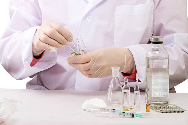 istock Doctor with ampoules meldonium 514939202