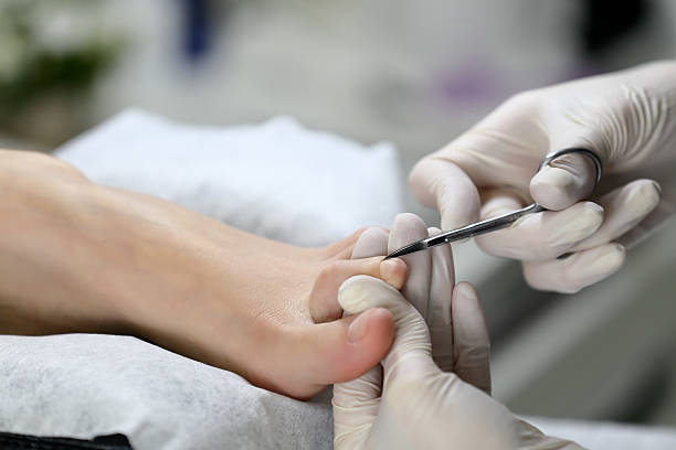 istock Close up Cutting cuticle on foot, nail scissors 514942384