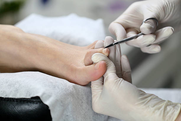 istock Close up Cutting cuticle on foot, nail scissors 514942420