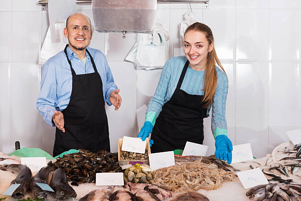istock Ordinary fish and seafood store with two sellers 514943454