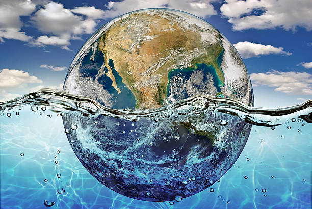 istock Earth is immersed in water, among  clouds against the sky. 514960703