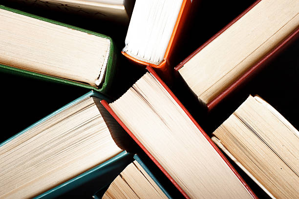 istock Old and used hardback books or text books seen 514961303