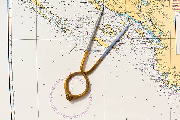 istock Pair of compasses for navigation on a sea map 514961555