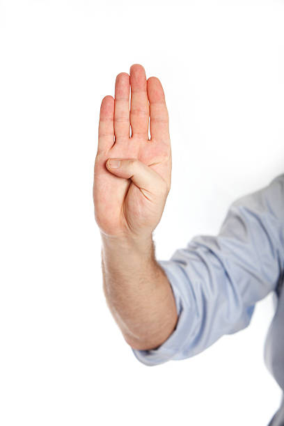 istock Man in a blue shirt shows four fingers 514961863