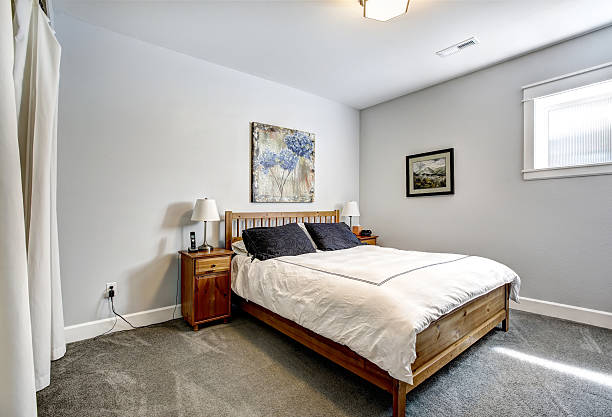 istock Bedroom in grey tones with wooden bed 514965165