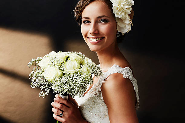 istock Stunning young bride holding bouquet, portrait 514965793