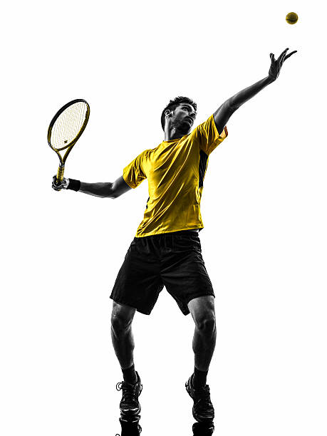 istock man tennis player at service serving silhouette 514966661
