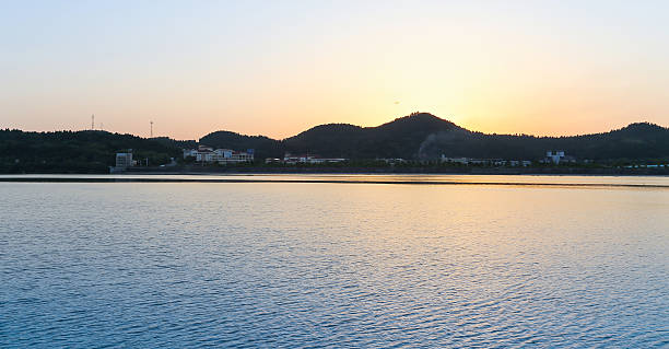 istock quiet lake at morning with sunrise 514967431